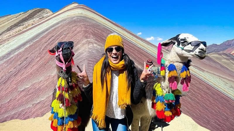 Rainbow Mountain Peru hike trail from Cusco hikers with alpacas